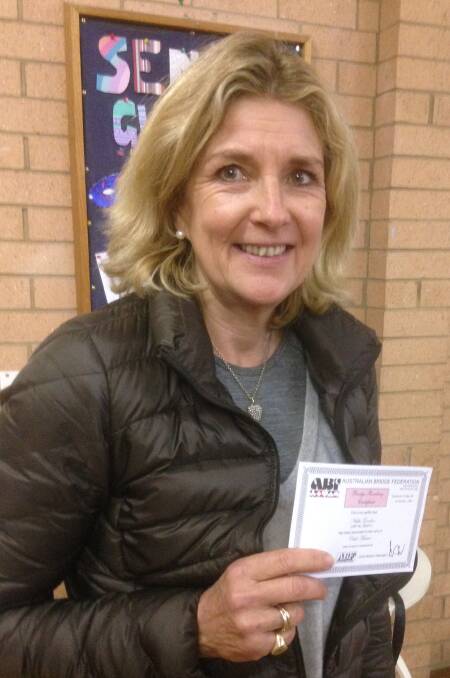 Well done: Nikki Gordon presented with her certificate for Club Master status.