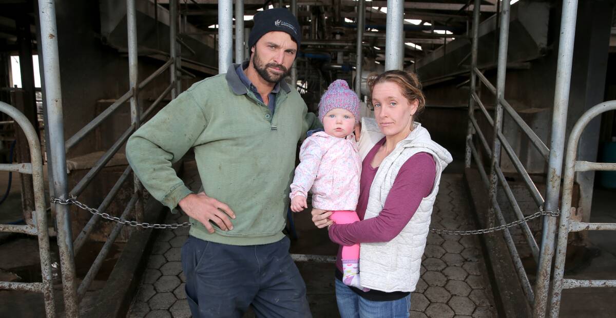 TOUGH TIMES: Kirkstall dairy farmers Rodney and Chloe Brown, with their daughter Charlotte, 14 months, are selling their cows. Picture: Rob Gunstone