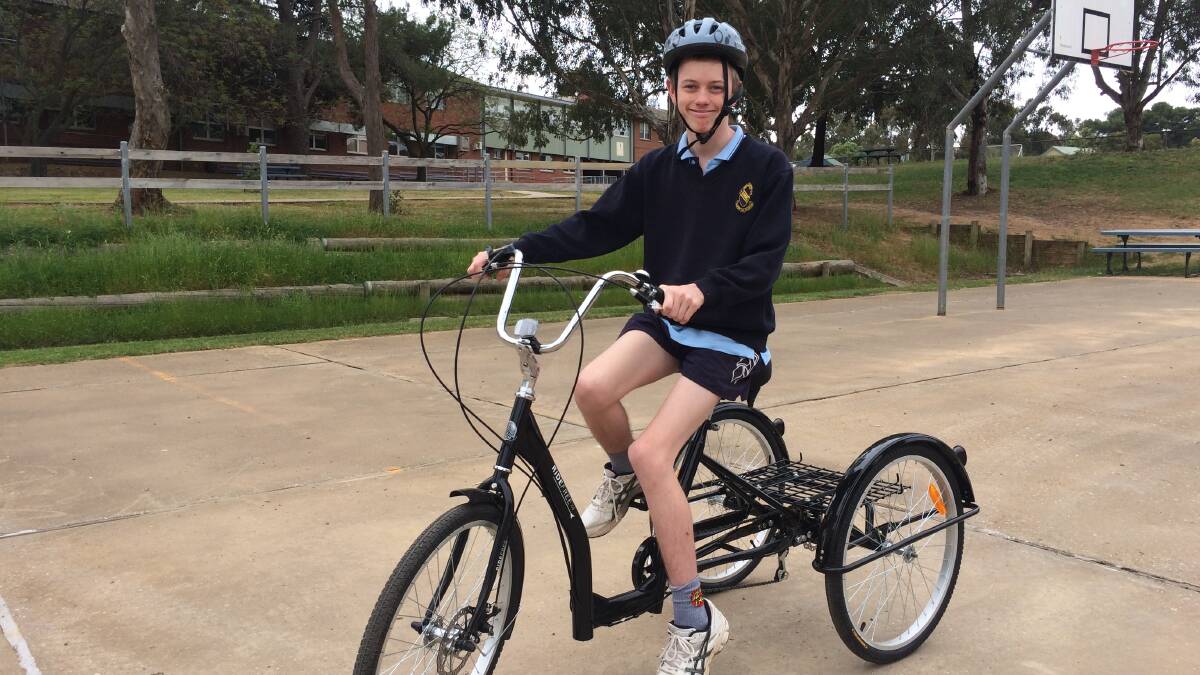 TOUCHING GESTURE: Junee High School student Jacob Stapleton was surprised with a new bike by the school and local Lions Club this week. 