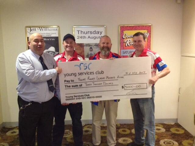 MAGIC MASTERS: Brad Pettit presenting the Major Sponsors cheque to Marc Owen, Darren Green and Col Banwell from the Cherryatrics.