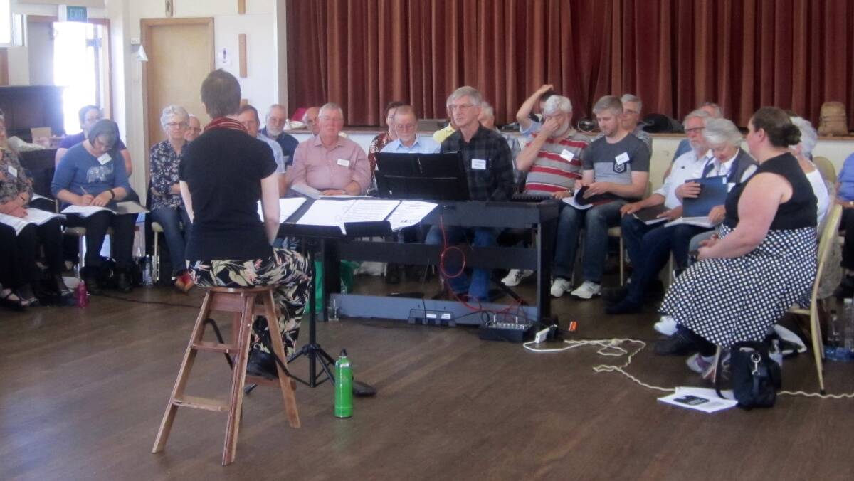 SING IT LOUD: The Choral Workshop assembled group with presenter Dr Sarah Penicka- Smith.