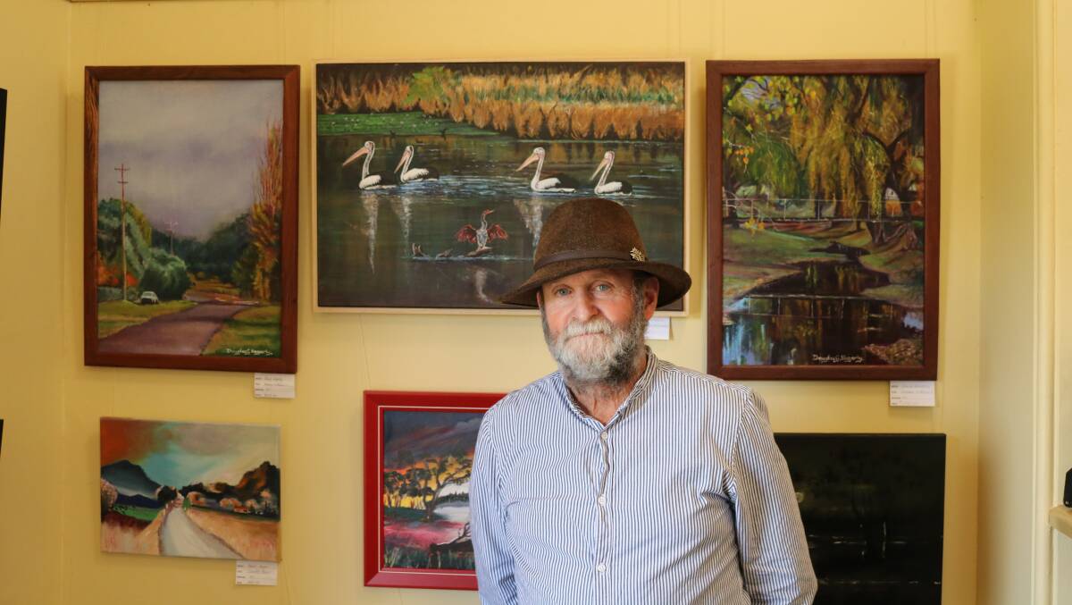 Dough Hegarty with his artworks.