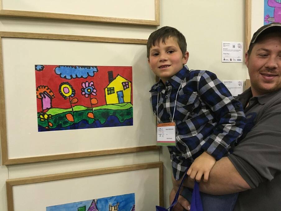 PRETTY AS A PICTURE: Bailey McKinnon and his artwork that is on display.