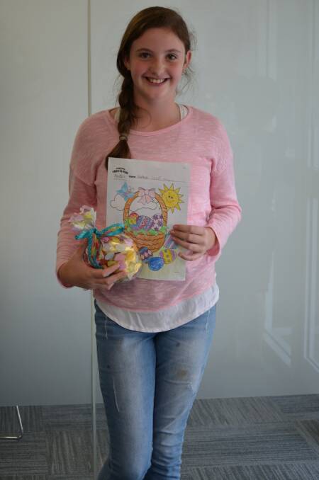 Sophie Gibson and her first place prize in the Young Witness Easter colouring competition.