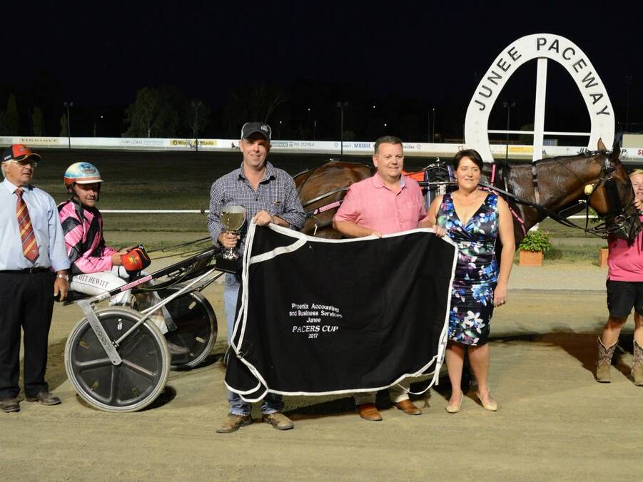 BIG WIN: Ned Pepper and his connections at Junee Paceway on Thursday night.