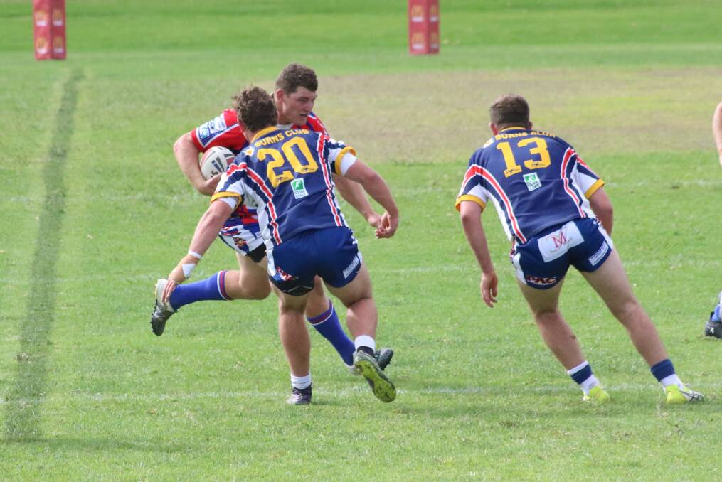 PUT THE SHOULDER IN: The Young Cherrypickers took on Tuggeranong last weekend as they won another trial game. Photo: Amanda Langman.