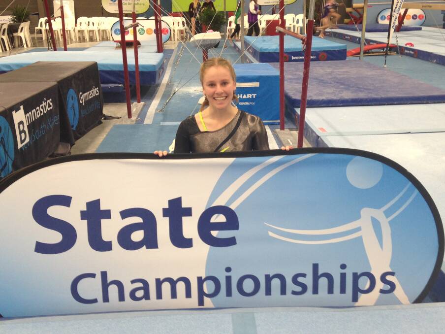 FLIPPING AWESOME: Shannon Robertson after her 9.025 score on the beam at the NSW State Gymnastics Championships in Sydney. Photo: Supplied.