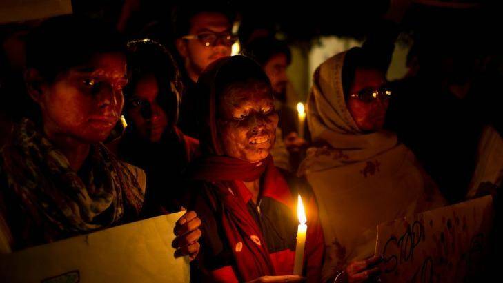 Acid attack survivors participate in a candlelit vigil protesting violence against women. Photo: SAURABH DAS