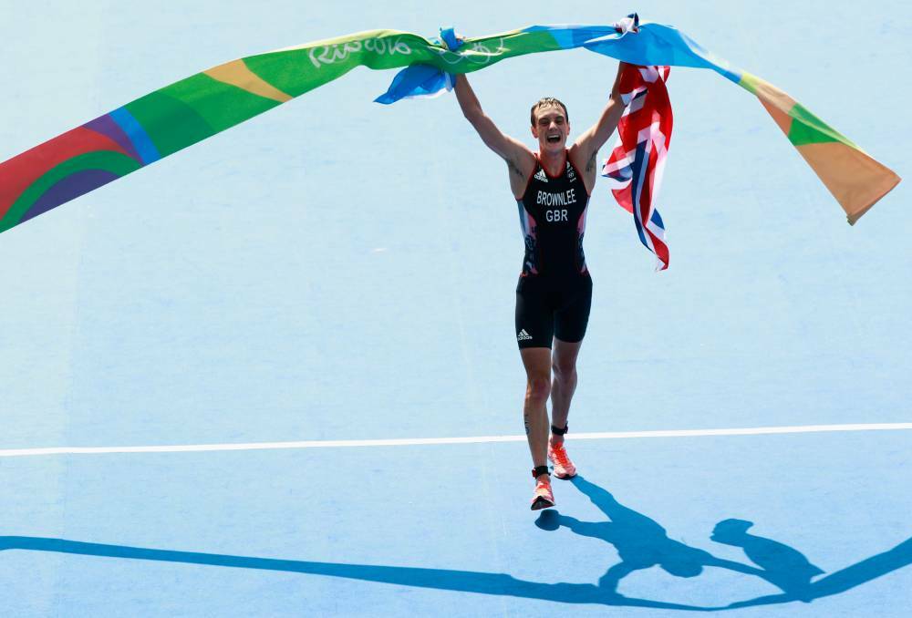 Alistair Brownlee of Great Britain celebrates after crossing the finish line during the Men's Triathlon at Fort Copacabana on Day 13 of the 2016 Rio Olympic Games on August 18, 2016 in Rio de Janeiro, Brazil. Photo: Adam Pretty/Getty Images
