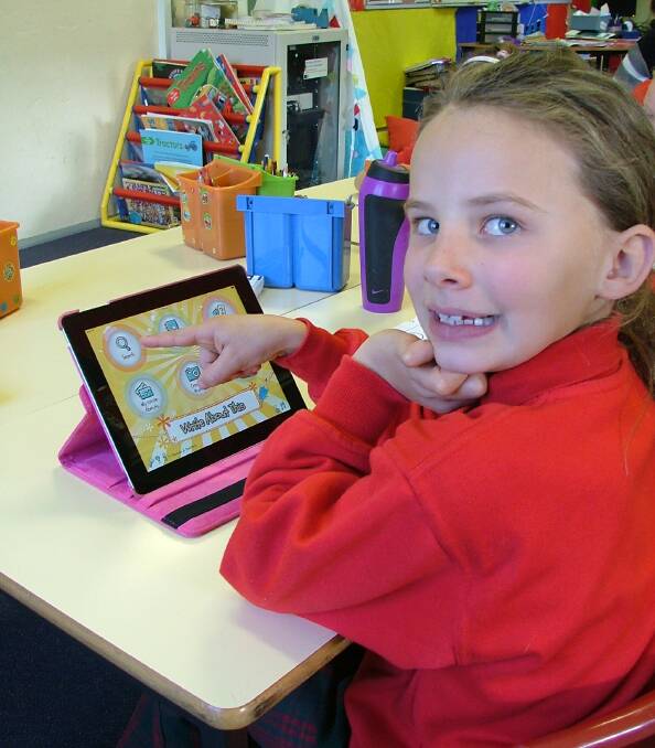 INNOVATIVE: Sarah Miller on one of the class iPads at Murringo Public School.
