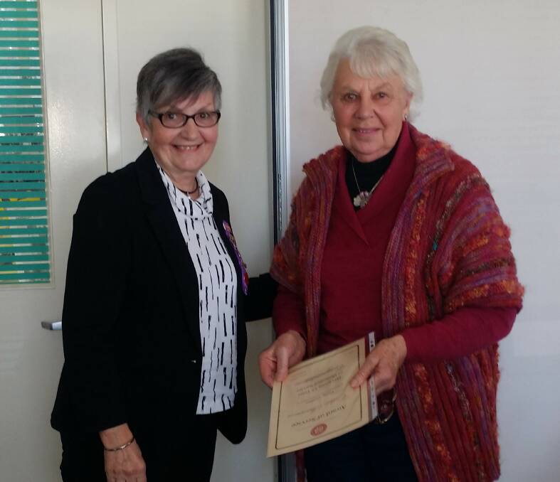 Linda Swales, UHA Riverina Area Representative and State President of UHA, presented Cathy Shannon with her 15 year service certificate.