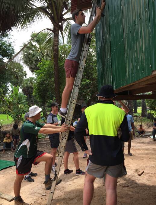 The Hennessy group hard at work in Cambodia.