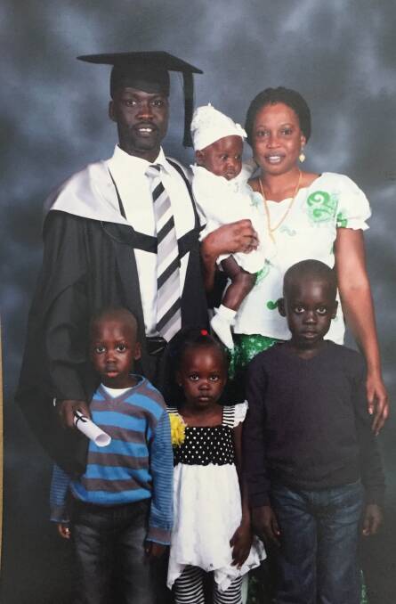 ACADEMIC: Elijah Buol with his wife Ashol and children Deng, Buol, Agaw and Yar at his graduation ceremony in 2015. Photo: Supplied