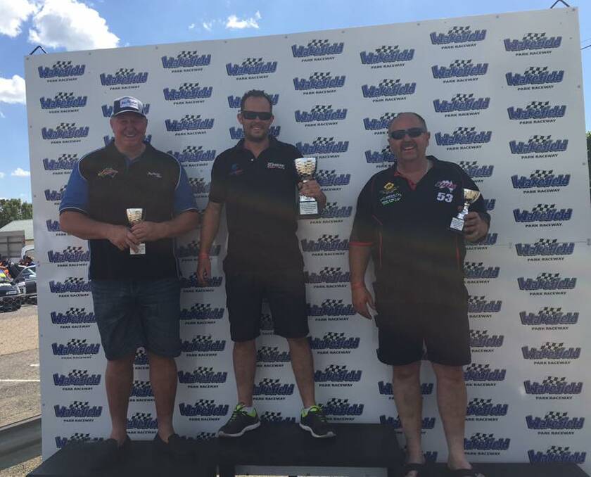 Ian McAlister pictured with first and third place getters on the weekend.