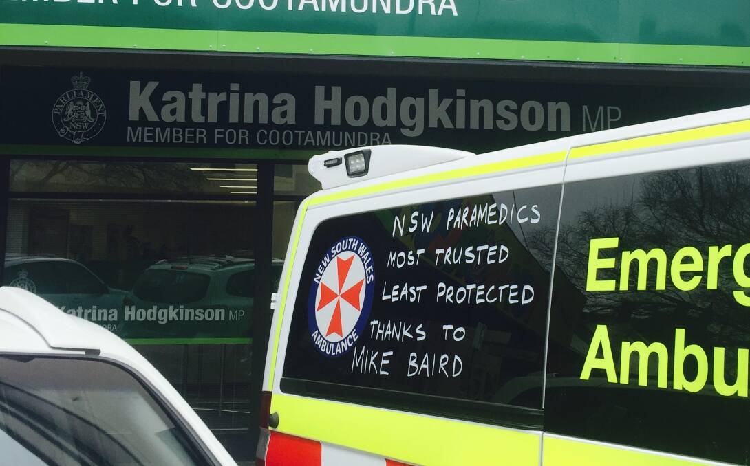 STATEMENT: Local paramedics parked their ambulance at the front of Katrina Hodgkinson's Boorowa Street office on September 15.