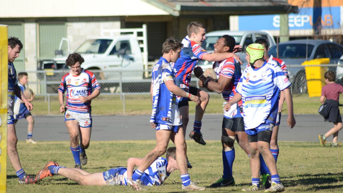 TRY: Reserve Grade Cherrypickers celebrate after a try in Cootamundra last week.