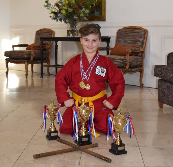 ACHIEVEMENT: Seven-year-old Corbyn Bomok of Young is pictured with his winnings for the 2016 AMAC Sydney Championships held on the weekend.