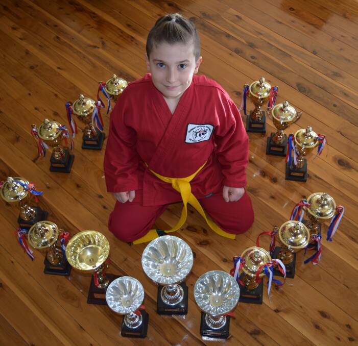 SUCCESS: Corbyn Bomok with his haul of trophies from the Martial Arts 2016 AMAC NSW State Title Championships.