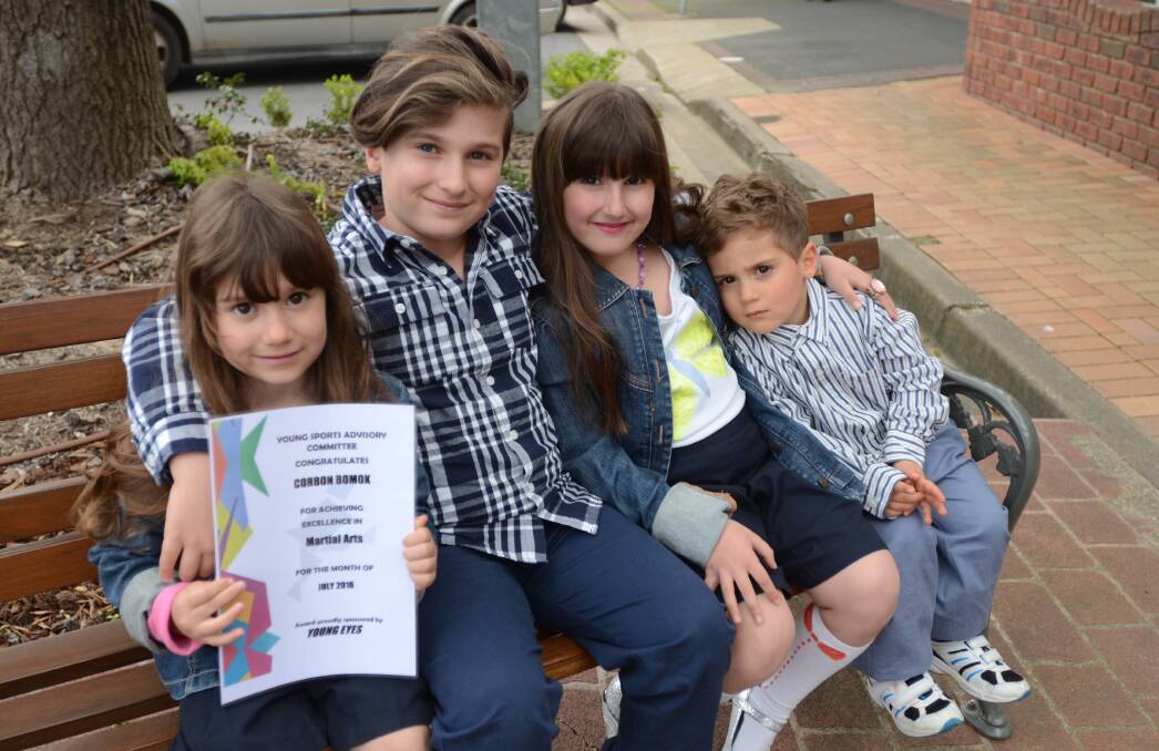 AWARD: Corbyn and his siblings Lyla, Evy and Rych pictured with the certificate. 