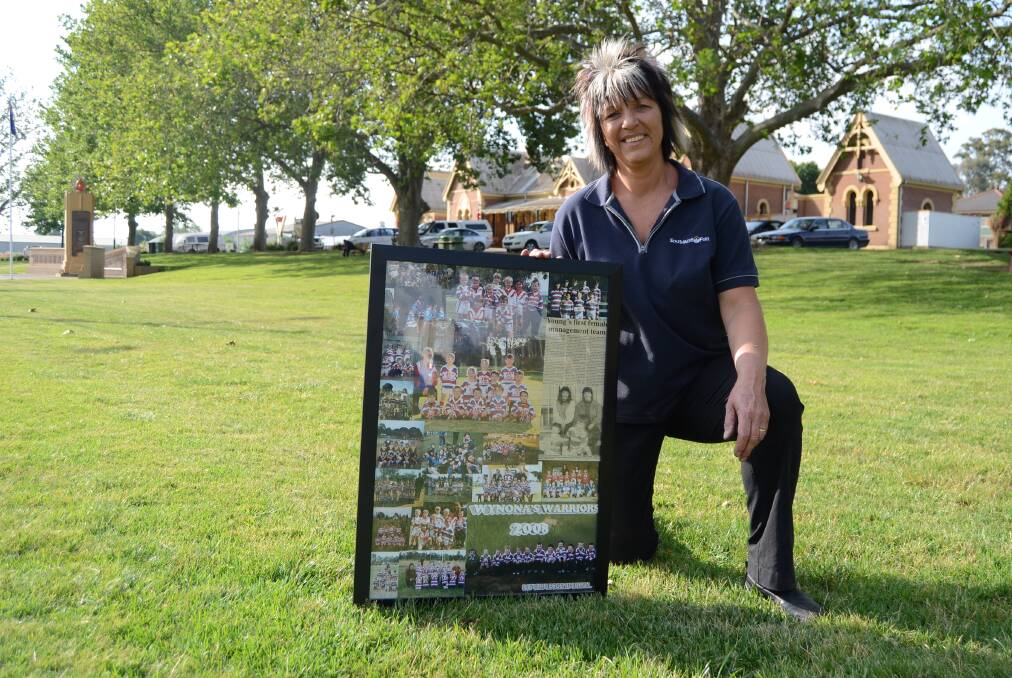 COACH: Young's Wenona Longhurst 
pictured with a frame of photos from 
the last 22 years.