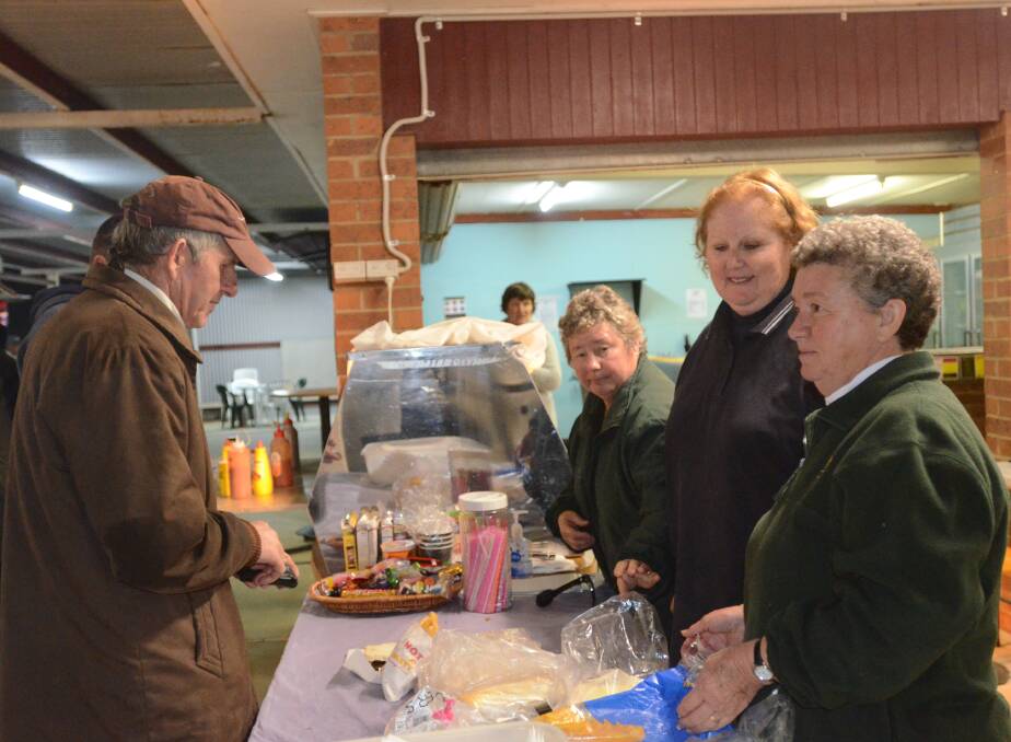 SERVICE: Trevor Dawhite was well looked after by the Lions Club ladies Pauline Geppart, Jenny Tate and Helen Sell at a May meeting at the Young Paceway.