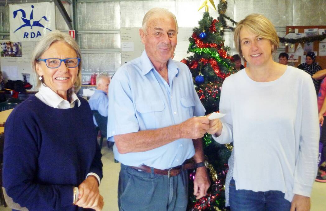 Good Deeds: Frank and Annie from Young Bridge Players Association handing over a cheque to Sue McGregor from Margaret House Women’s Refuge at Young. 