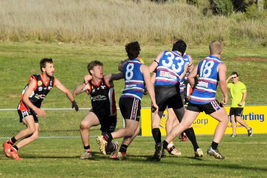 TOUGH GAME: Young's Cameron Hobbs and Justin Kelly put the pressure on the Parkes Panthers during the Saints' last game of the season. Photo: Parkes Champion Post