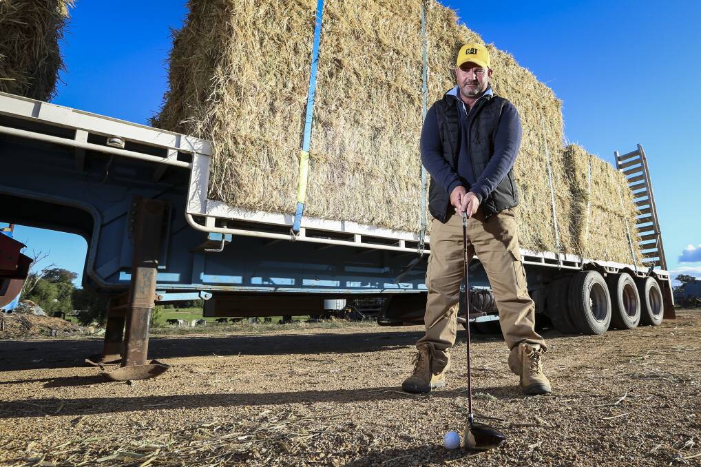 ON PAR: From driving trucks laden with hay to driving home a new golf shed project, Brendan Farrell keeps rollin' out help. Picture: JAMES WILTSHIRE