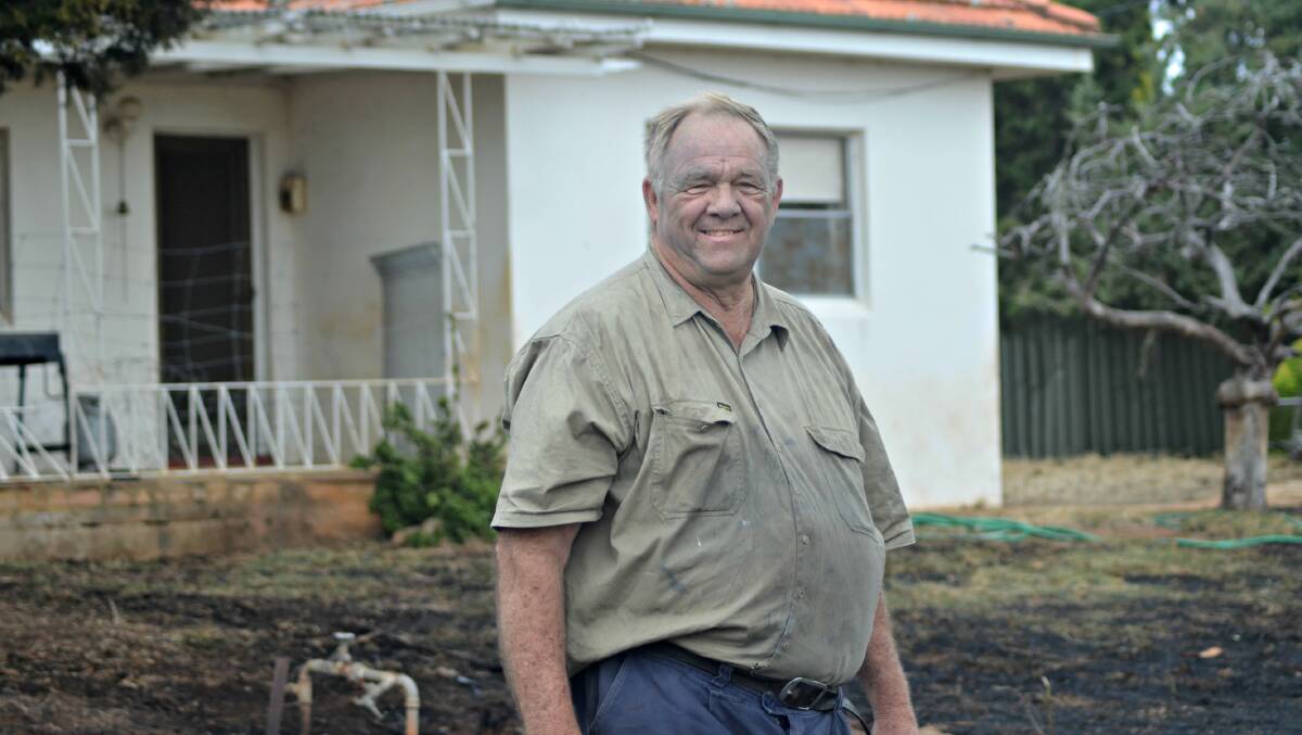 THANK YOU FIRIES: Young local Terry Jackson was on the scene to see fire fighters save his son’s house. Picture: Craig Thomson.