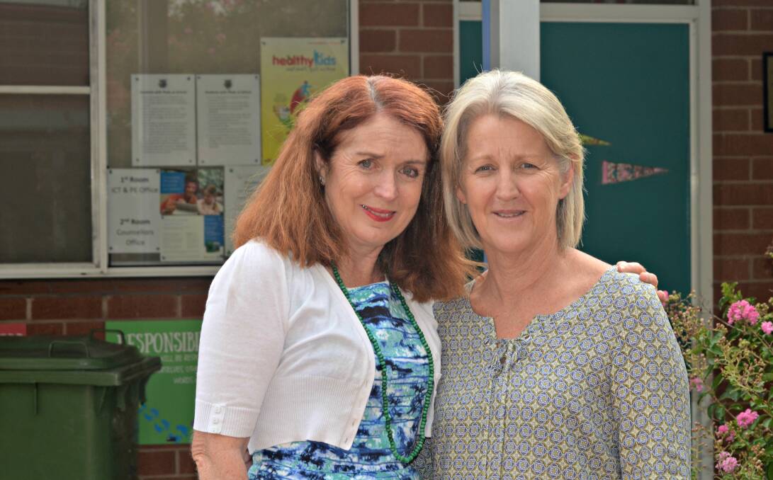 Good friends: School Principal Louise Grant was sad to see retiring school stalwart Mary Mannion leave the school last week. Picture: Craig Thomson.