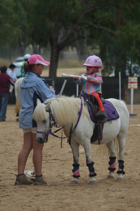 Lexis Matthews with mum Kerri enjoying the activities at Young Pony Club's first rally day of the year.
