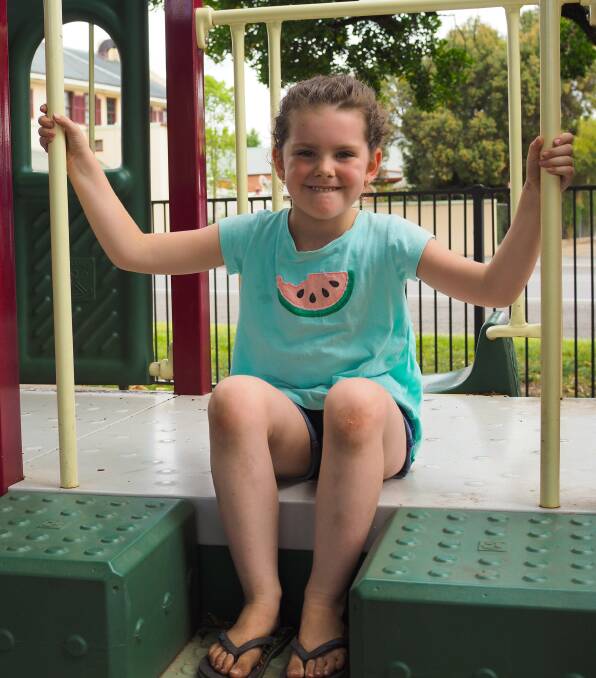 Abby Bognar enjoying a local playground.