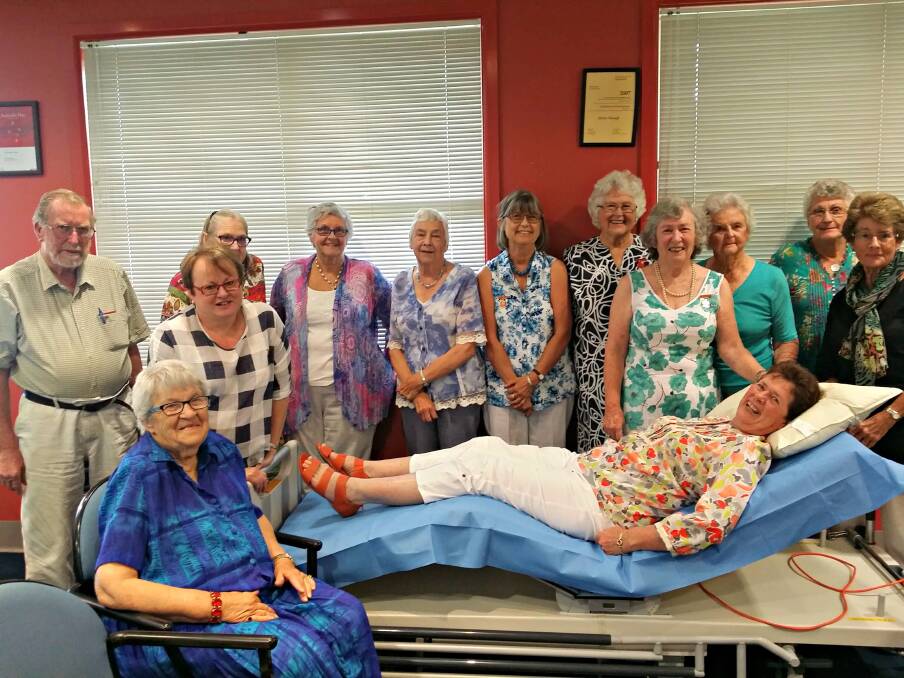Bedridden: Hospital Auxiliary members and Sandra Latham try out the trauma bed they decided to buy for the emergency department. Picture Supplied.