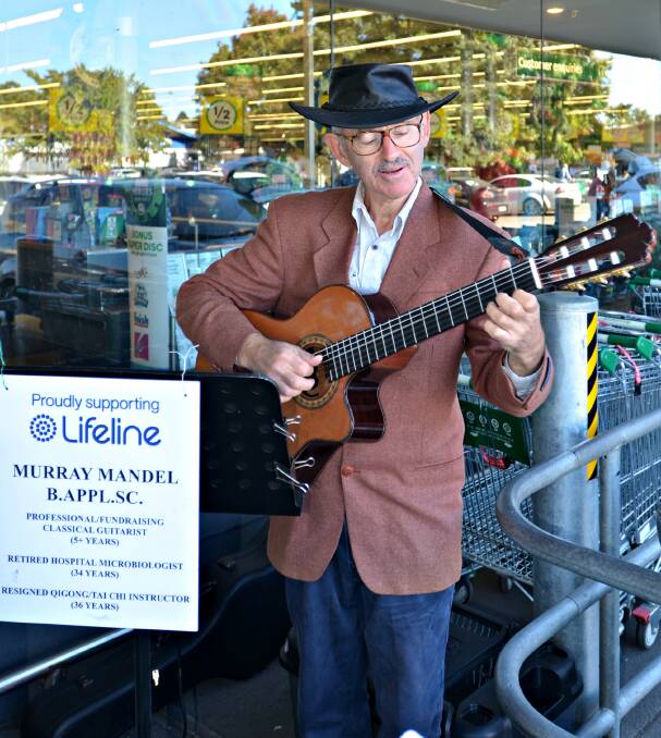 LISTEN TO THE MUSIC: Murray Mandel is raising money for Lifeline playing classical guitar on the streets around Australia over the next three years. Picture: Craig Thomson.