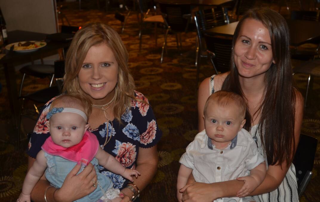 Kylie and Indi Wilder and Emma and Charlie Whitechurch made new year's eve a family affair at the services club. 