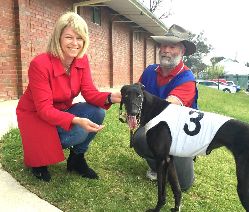 INDUSTRY SUPPORT: Katrina Hodgkinson with Greg Katon and his greyhound Smooth Pearl at a meeting of the Young  District Greyhound Racing Club last year.