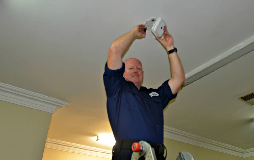 FIRE SAFE: Deputy Captain Matt Dreverman said now is a good time to look at replacing the smoke alarm in your home.Picture: Craig Thomson.