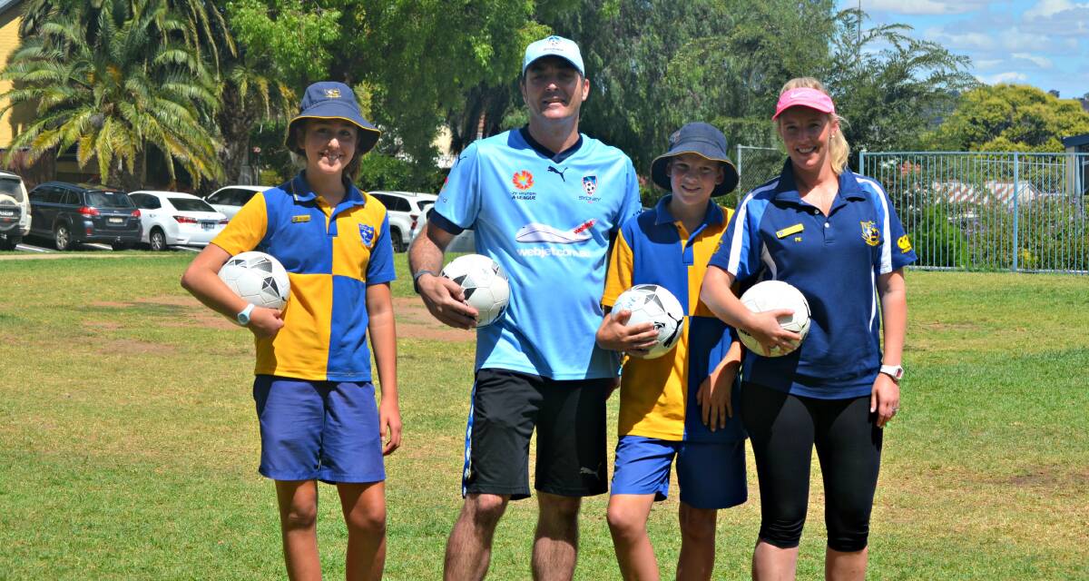 Footy fun: Sienna Capra, Sam Gray, Tristan Summerfield and Amy Ryals are keen to get out in the sun and play soccer. Picture: Craig Thomson. 