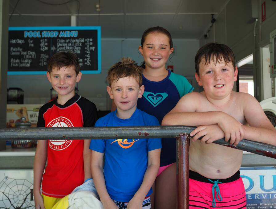Tyson Hunter, Liam Holt, Andrea Hunter and Callum Holt cooling off at the pool.
