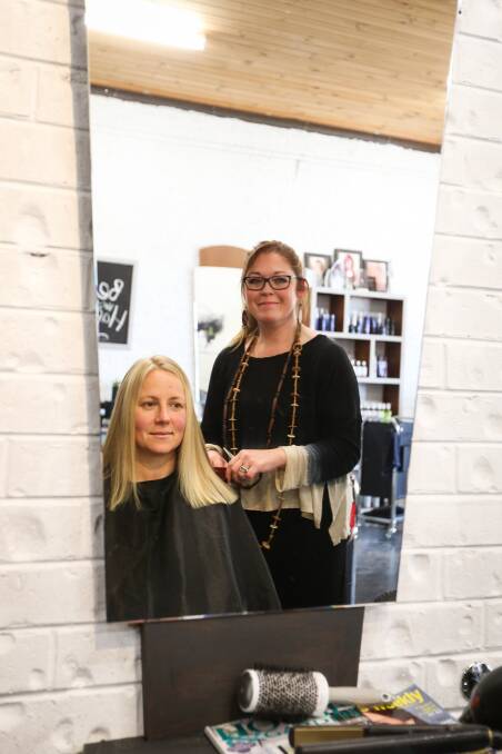 Hairdresser Lucy Tozer and client Rachel Kerkvliet are excited for Ritchies' re-opening to bring activity back to that part of town. Picture: JAMES WILTSHIRE