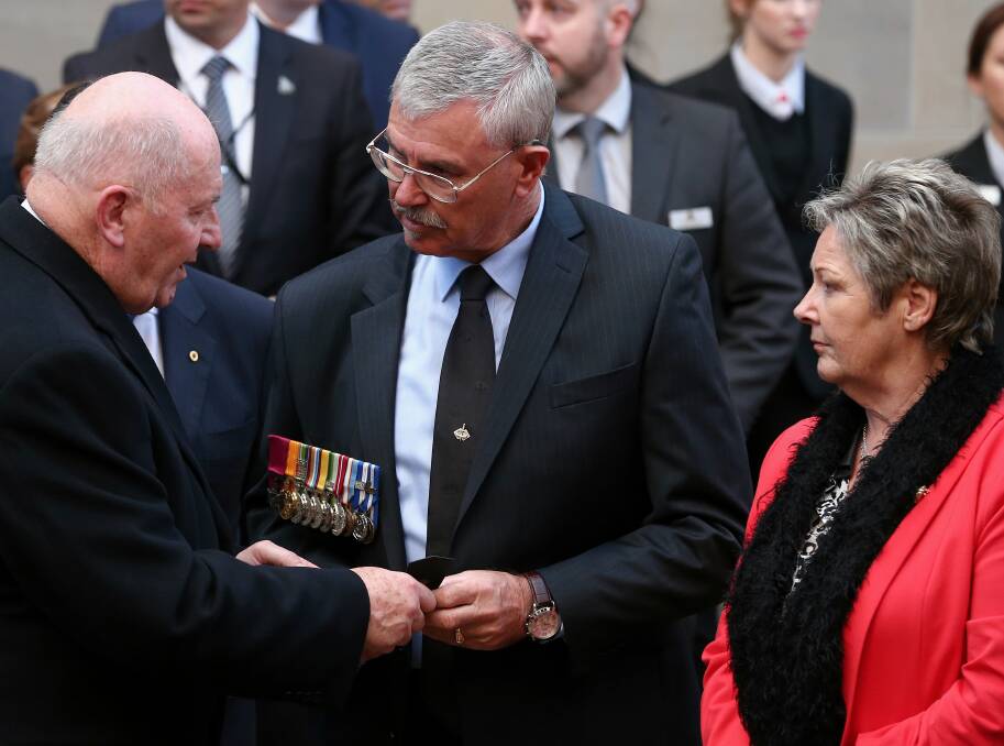 HONOUR: Doug and Kaye Baird with the Governor-General, Sir Peter Cosgrove, at the Australian War Memorial where Corporal Baird's kit is on display.