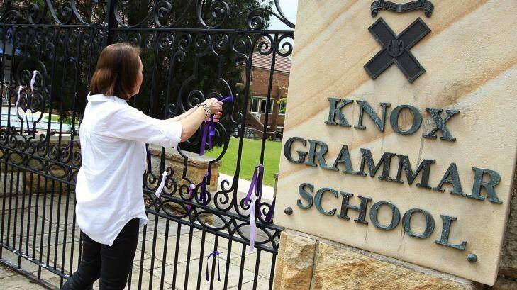 Ribbons being tied to the gates at Knox Grammar School. Photo: Ben Rushton