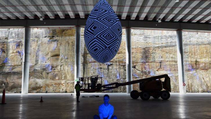 Andrew and his work displayed in the huge space at Brrangaroo. Photo: Nick Moir