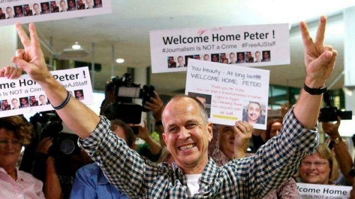 Peter Greste arrives home at Brisbane Airport