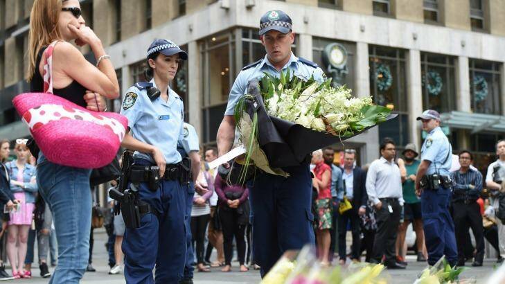 Chris Sheehy joined thousands of Sydneysiders laying flowers following the Martin Place siege. Photo: Dean Lewins