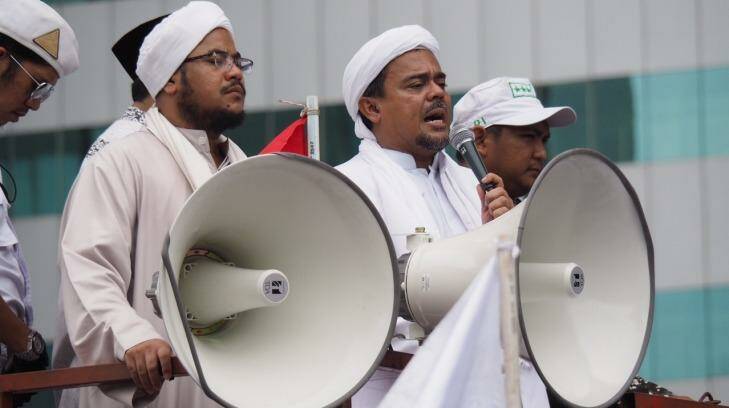 Muhammad Rizieq Shihab, also known as Habib Rizieq, addresses protesters outside Indonesian police headquarters.   Photo: Dewi Nurcahyani