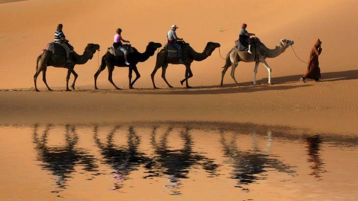 Travel is a mind-opening experience. Try, for example, a camel caravan in the Sahara Desert, Morocco. Photo: iStock