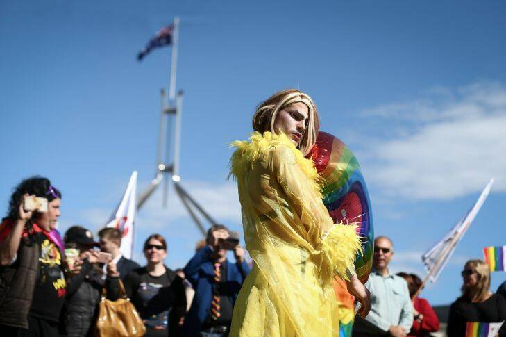 Supporter of marriage equality, Beau Kirq on the front lawn of Parliament House in Canberra on Monday 14 August 2017. fedpol. Photo: Alex Ellinghausen