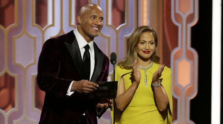 Dwayne Johnson and Jennifer Lopez present an award at the 73rd Annual Golden Globe Awards in January 2016. Photo: Paul Drinkwater
