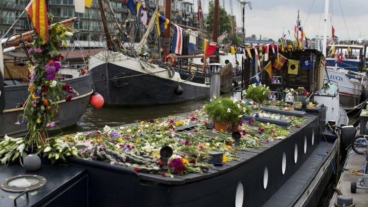 Flowers have been left on the houseboat where Jo Cox lived in Hermitage Moorings on the River Thames in Wapping, London. Photo: Matt Dunham/AP